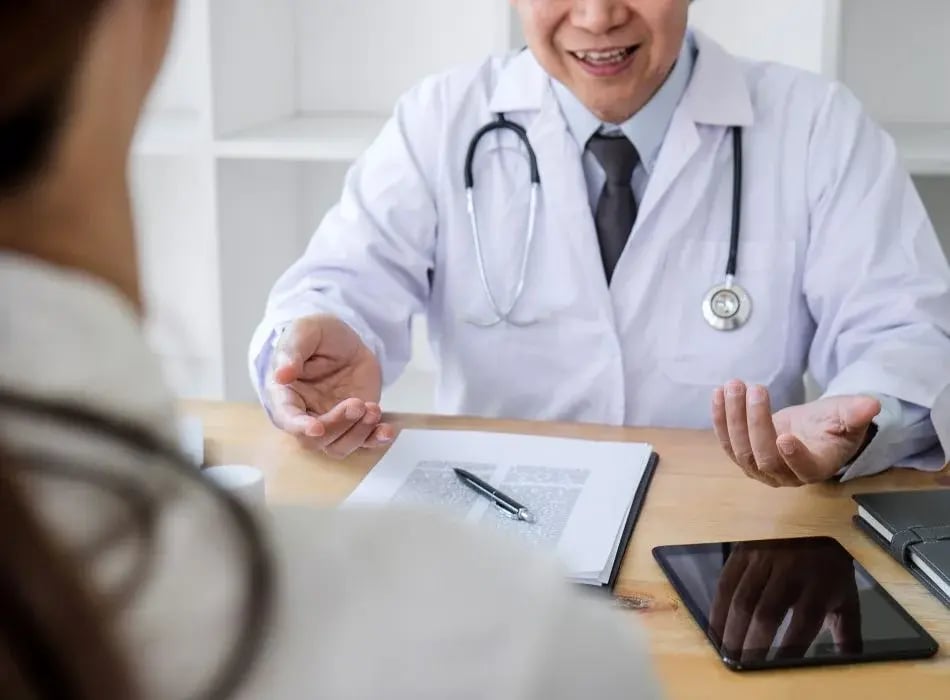 doctor and patient at desk