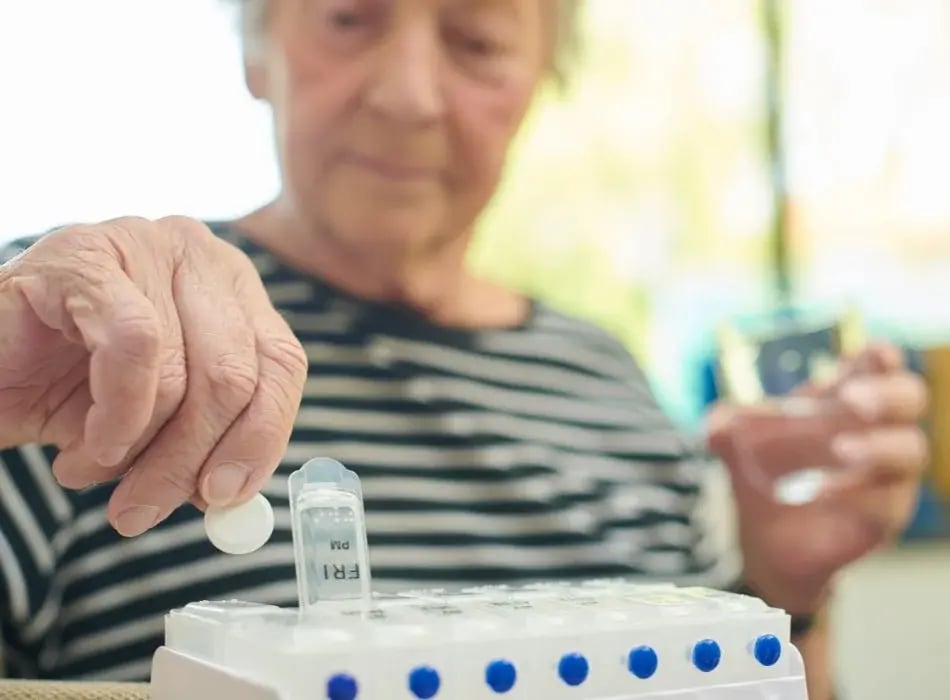 woman organizing medication