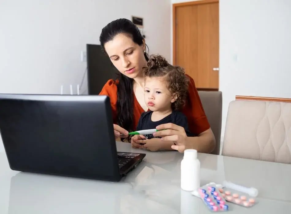 mom with daughter at laptop