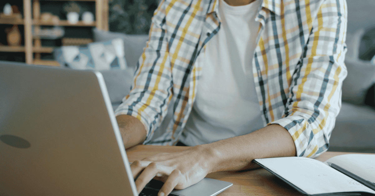 Man typing on his keyboard
