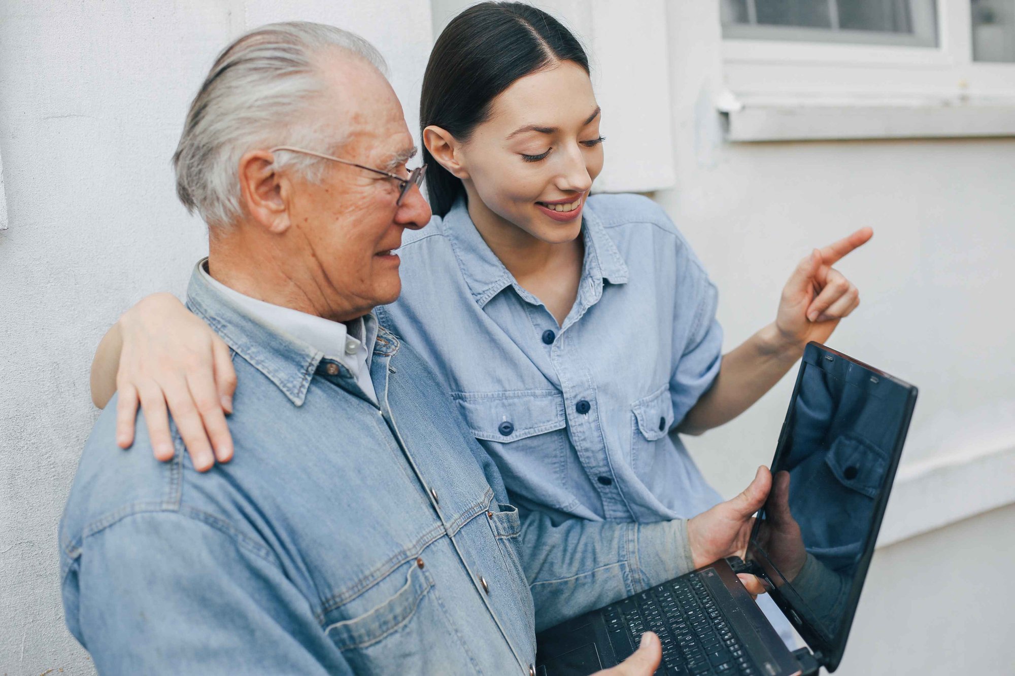 girl-teaching-her-grandfather-how-use-laptop_11zon girl-teaching-her-grandfather-how-use-laptop_11zon